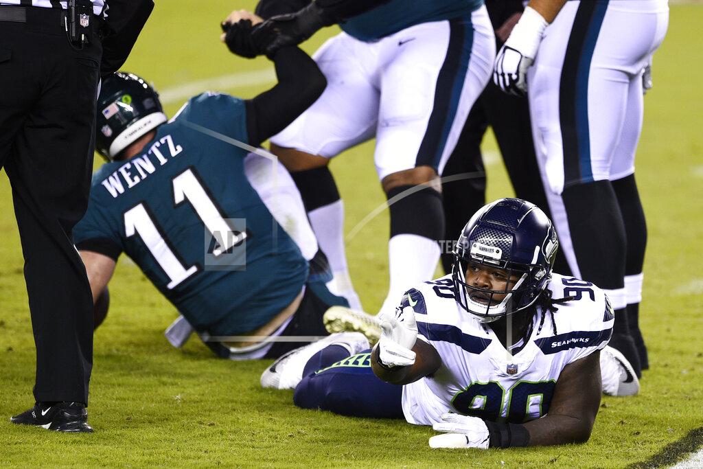Derik Hamilton Seattle Seahawks' Jarran Reed (90) reacts after tackling Philadelphia Eagles' Carson Wentz (11) during the first half of an NFL football game, Monday, Nov. 30, 2020, in Philadelphia. (AP Photo/Derik Hamilton)