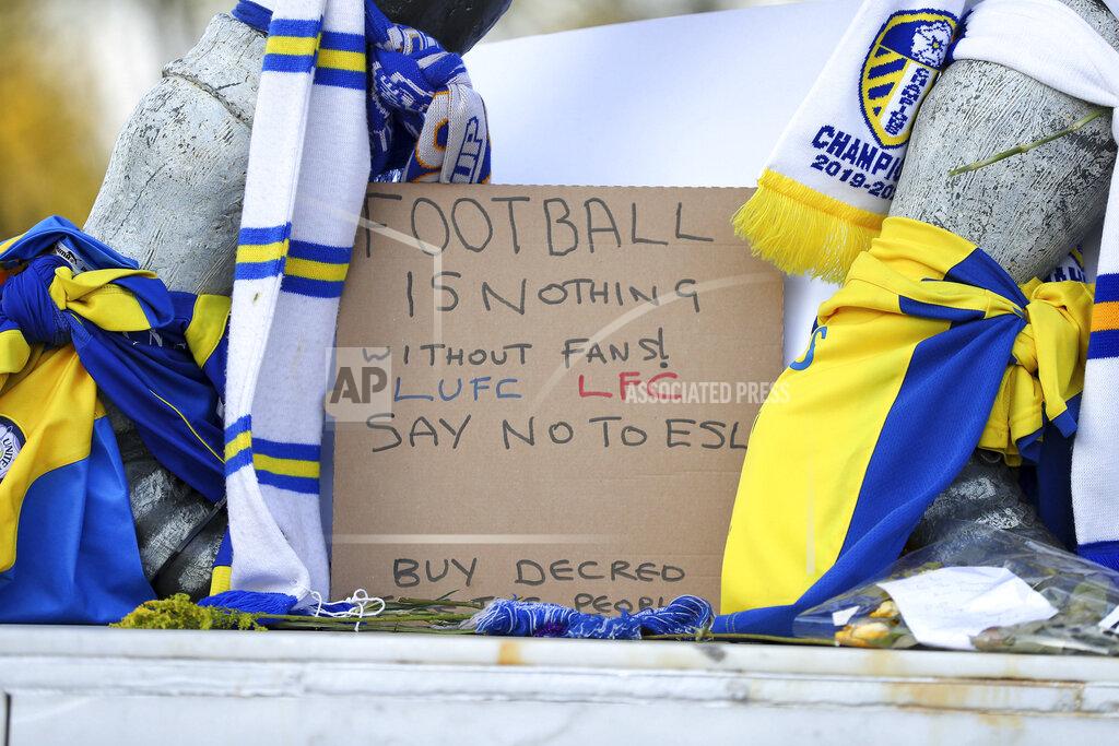 Zac Goodwin Close up of a banner as fans protest outside Elland Road against Liverpool's decision to be included amongst the clubs attempting to form a new European Super League, in Leeds, England, Monday, April 19, 2021. Reaction to the proposals from 12 clubs to rip up European soccer by forming a breakaway Super League has ranged from anger and condemnation to humor and sarcasm. (Zac Goodwin/PA via AP)