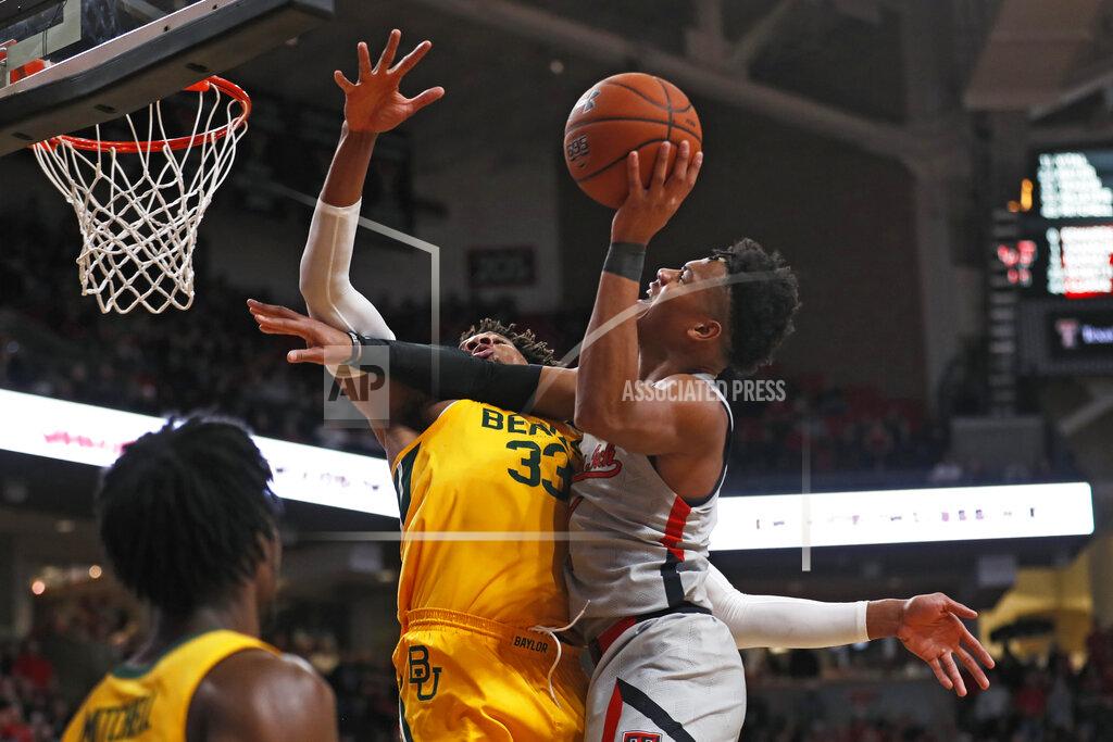 Brad Tollefson Texas Tech's Terrence Shannon Jr. (1) tries to shoot over Baylor's Freddie Gillespie (33) during the first half of an NCAA college basketball game Tuesday, Jan. 7, 2020, in Lubbock, Texas. (AP Photo/Brad Tollefson)