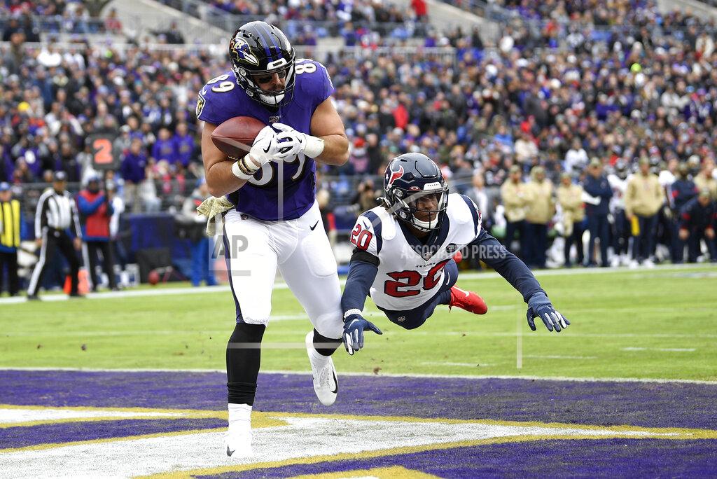 Nick Wass Baltimore Ravens tight end Mark Andrews (89) catches a touchdown pass from quarterback Lamar Jackson, not visible, as Houston Texans strong safety Justin Reid (20) dives to try to stop him during the first half of an NFL football game, Sunday, Nov. 17, 2019, in Baltimore. (AP Photo/Nick Wass)
