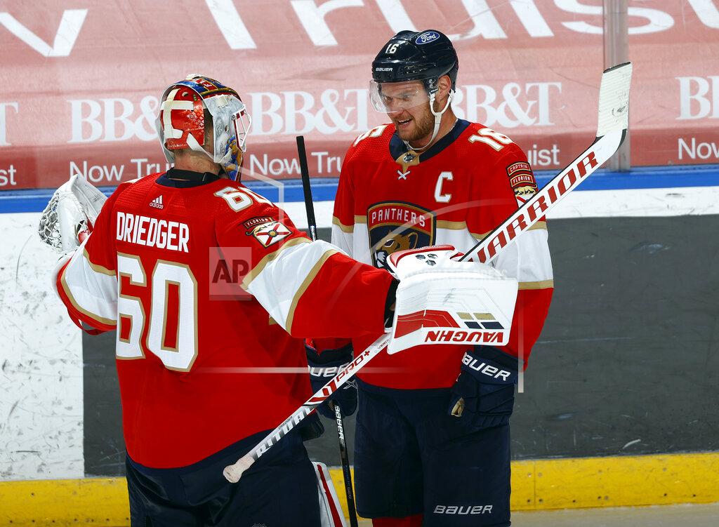 Joel Auerbach Florida Panthers goaltender Chris Driedger (60) celebrates with center Aleksander Barkov (16), who scored in overtime of the team's NHL hockey game against the Carolina Hurricanes, Saturday, April 24, 2021, in Sunrise, Fla. (AP Photo/Joel Auerbach)