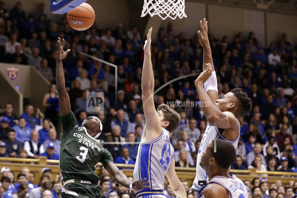 Gerry Broome Colorado State guard Kendle Moore (3) drives to the basket while Duke forward Joey Baker (13) and forward Javin DeLaurier, right, defend during the first half of an NCAA college basketball game in Durham, N.C., Friday, Nov. 8, 2019. (AP Photo/Gerry Broome)