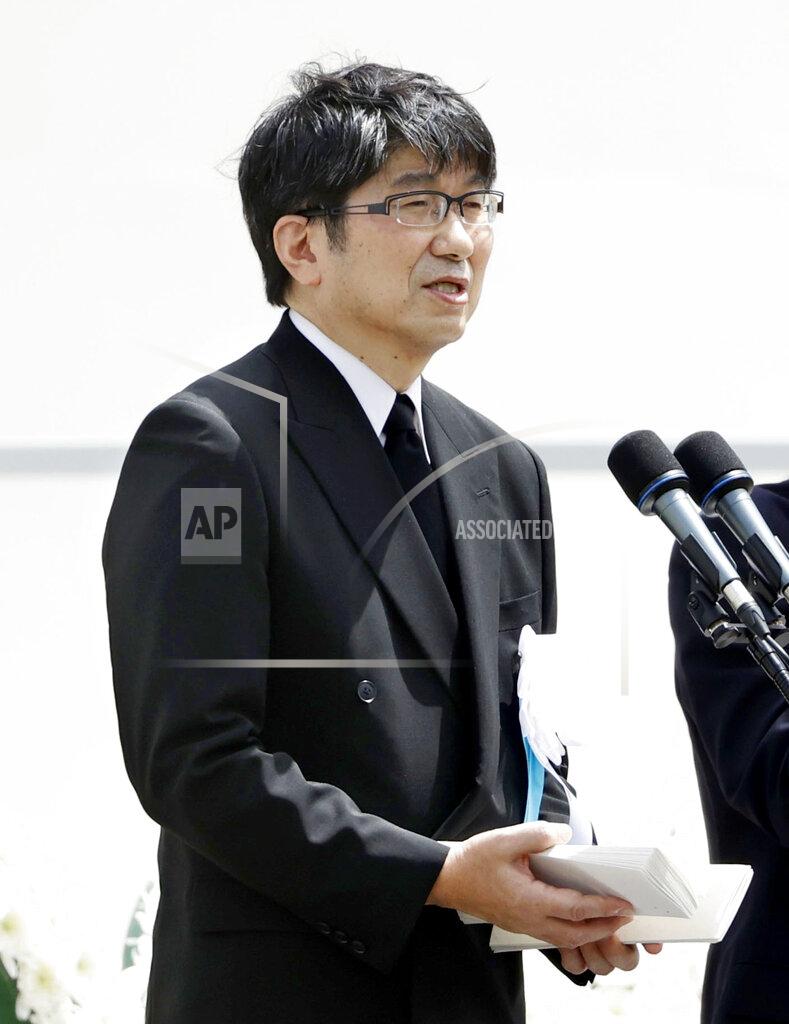 Uncredited Mayor Tomihisa Taue delivers a speech during a ceremony to mark the 75th anniversary of the U.S. atomic bombing at the Peace Park in Nagasaki, southern Japan Sunday, Aug. 9, 2020. At the event at Nagasaki Peace Park, scaled down because of the coronavirus pandemic, Mayor Taue read a peace declaration in which he raised concern that nuclear states had in recent years retreated from disarmament efforts. (Kyodo News via AP)