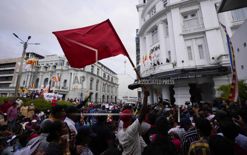 Eranga Jayawardena Members of Socialist Youth Union shout slogans blocking the entrance to Sri Lanka's police headquarters during a protest in Colombo, Sri Lanka, Monday, May 16, 2022. Sri Lanka’s prime minister on Monday proposed to privatize the country’s loss-making national carrier as part of reforms to solve the country worst economic crisis in recent memory. (AP Photo/Eranga Jayawardena)