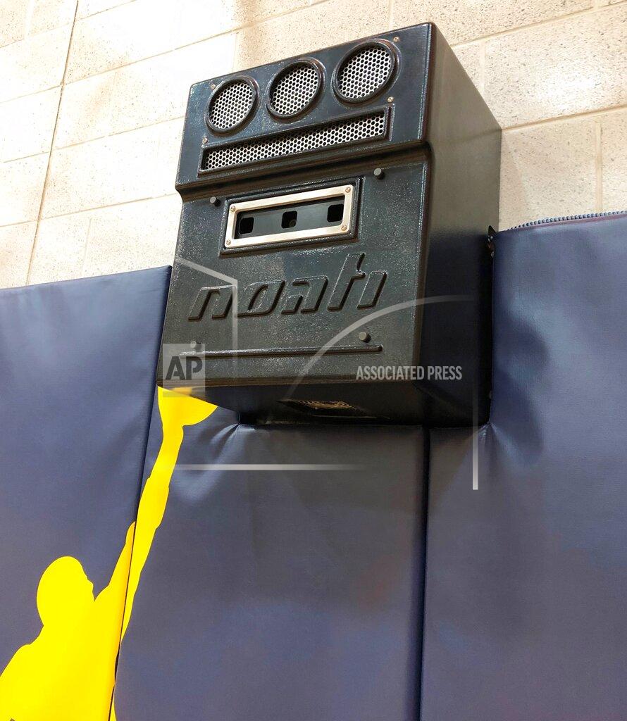 Noah Trister In a photo from February 2019, the Noah Basketball system, shown in Ann Arbor, Mich., can measure both the arc and accuracy of a player's shots--an attempt to blend old-fashioned repetition with analytics and technology as players strive to improve their shooting. As the nation's top teams compete in the NCAA Tournament, games will be won and lost from the 3-point line and the foul line. (AP Photo/Noah Trister)