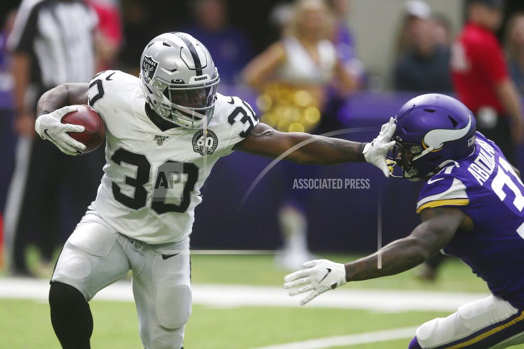 Jim Mone Oakland Raiders running back Jalen Richard (30) tries to break a tackle by Minnesota Vikings running back Ameer Abdullah, right, during the first half of an NFL football game, Sunday, Sept. 22, 2019, in Minneapolis. (AP Photo/Jim Mone)