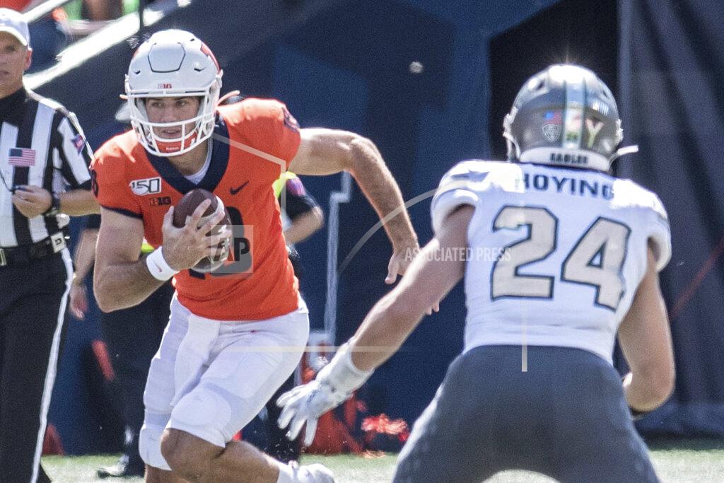 Holly Hart Illinois quarterback Brandon Peters (18) runs the ball as Eastern Michigan's Brody Hoying (24) defends in the first half of a NCAA college football game between Illinois and Eastern Michigan, Saturday, Sept.14, 2019, in Champaign, Ill. (AP Photo/Holly Hart)