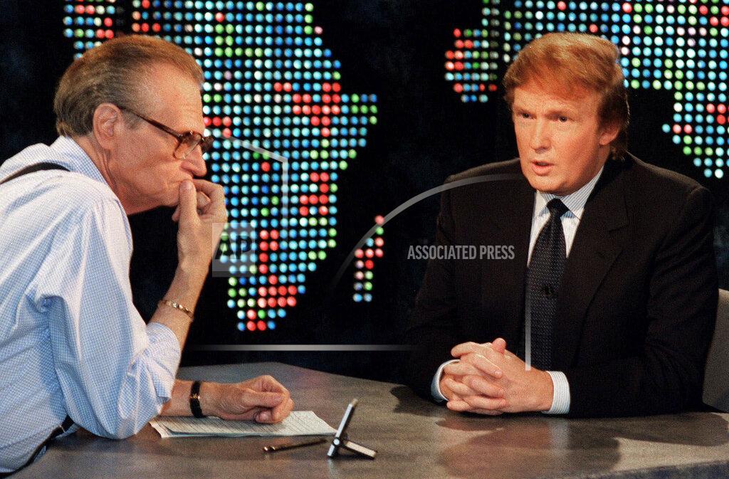 Marty Lederhandler FILE - In this Oct. 7, 1999 file photo, Donald Trump, right, is interviewed by Larry King during a taping of "Larry King Live," in New York. King, who interviewed presidents, movie stars and ordinary Joes during a half-century in broadcasting, has died at age 87. Ora Media, the studio and network he co-founded, tweeted that King died Saturday, Jan. 23, 2021 morning at Cedars-Sinai Medical Center in Los Angeles. (AP Photo/Marty Lederhandler, File)