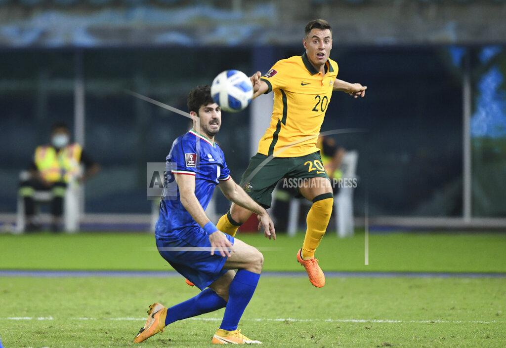 Jaber Abdulkhaleg Australia's Chris Ikonomidis, right, attempts a head at goal in front of Kuwait's Khaled Ibrahim during the World Cup 2022 Group B qualifying soccer match between Kuwait and Australia in Kuwait City, Kuwait, Thursday, June 3, 2021. (AP Photo/Jaber Abdulkhaleg)