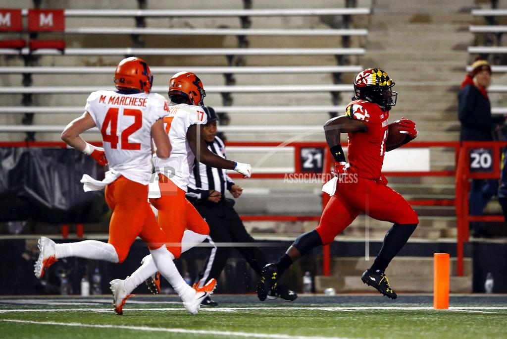 Patrick Semansky Maryland tight end Chigoziem Okonkwo, right, rushes past Illinois defensive backs Michael Marchese (42) and Kendall Smith for a touchdown in the second half of an NCAA college football game, Saturday, Oct. 27, 2018, in College Park, Md. (AP Photo/Patrick Semansky)