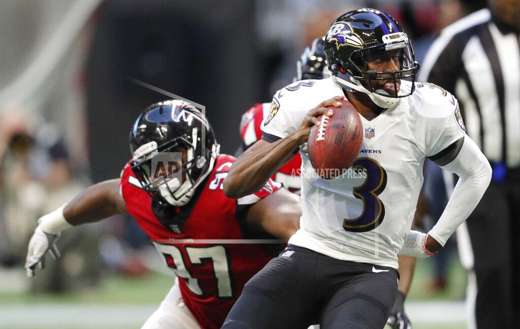John Bazemore FILE - In this Dec. 2, 2018, file photo, Baltimore Ravens quarterback Robert Griffin III (3) runs out of the pocket as Atlanta Falcons defensive tackle Grady Jarrett (97) defends during the second half of an NFL football game in Atlanta. The Falcons have placed a franchise tag on Jarrett while saying they still hope to negotiate a long-term contract with the defensive tackle. (AP Photo/John Bazemore, File)