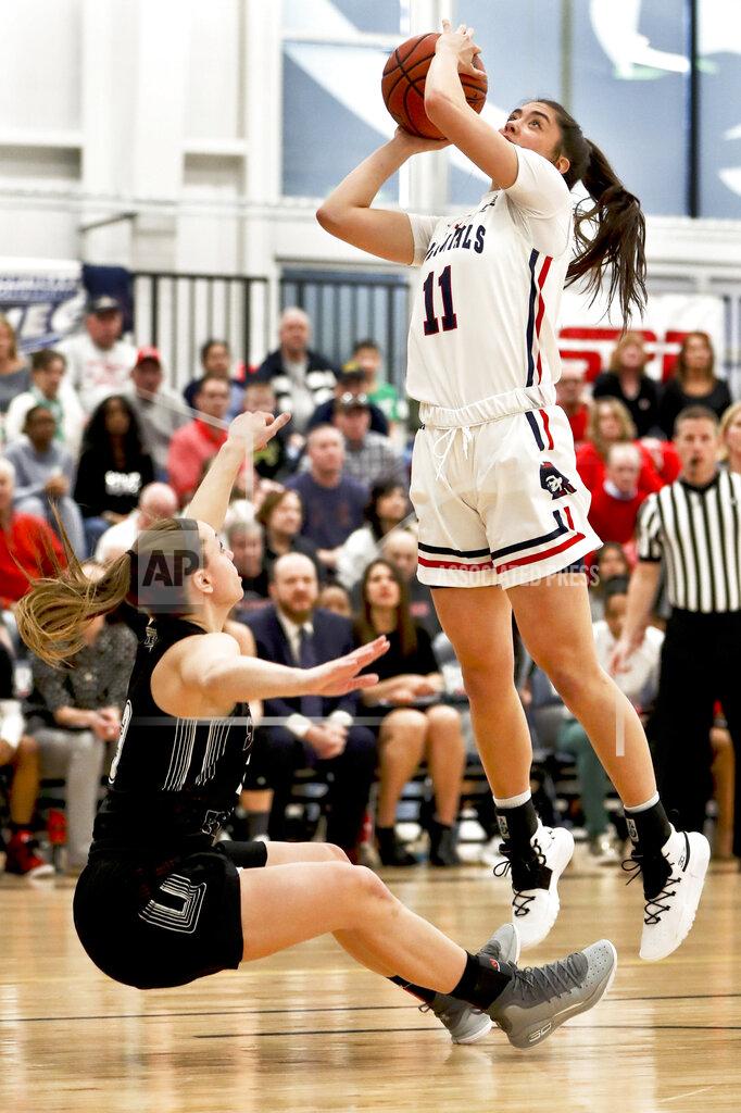 Keith Srakocic Robert Morris' Natalie Villaflor (11) shoots as St. Francis (Pa)'s Karson Swogger, left, defends during the first half of an NCAA college basketball game for the championship of the Northeast Conference women's tournament, Sunday, March 17, 2019, in Moon, Pa. (AP Photo/Keith Srakocic)