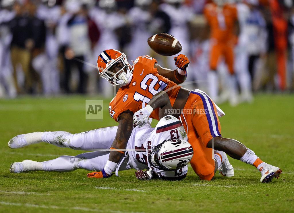Richard Shiro Clemson's K'Von Wallace (12) breaks up a pass intended for South Carolina's Shi Smith during the first half of an NCAA college football game Saturday, Nov. 24, 2018, in Clemson, S.C. (AP Photo/Richard Shiro)