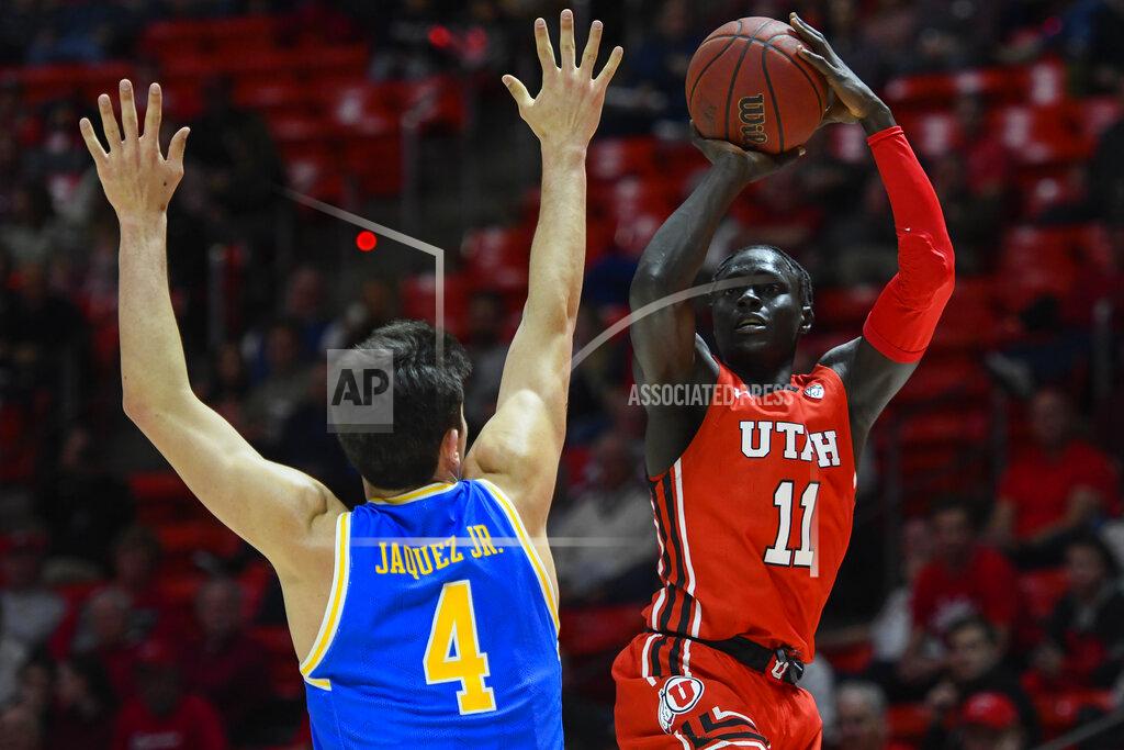 Alex Goodlett Utah guard Both Gach (11) shoots over UCLA guard Jaime Jaquez Jr. (4) during the second half of an NCAA college basketball game Thursday, Feb. 20, 2020, in Salt Lake City. (AP Photo/Alex Goodlett)