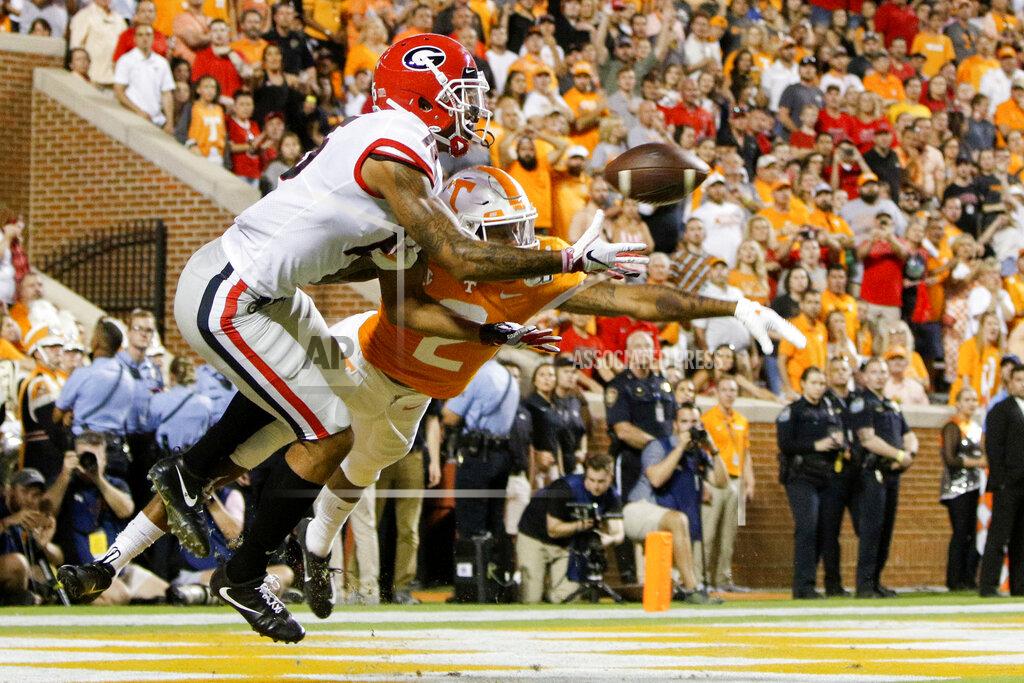 C.b. Schmelter Georgia wide receiver Lawrence Cager (15) pulls in a 3-yard touchdown reception against Tennessee defensive back Alontae Taylor (2) during an NCAA college football game Saturday, Oct. 5, 2019, in Knoxville, Tenn. (C.B. Schmelter/Chattanooga Times Free Press via AP)