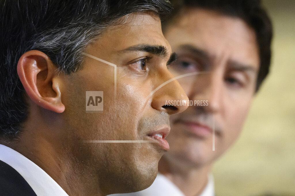 Leon Neal FILE - British Prime Minister Rishi Sunak, left, and Canadian Prime Minister Justin Trudeau hold a press conference at the G20 summit in Nusa Dua, Bali, Indonesia, Nov. 16, 2022. In his first month as Britain's prime minister, Sunak has stabilized the economy, reassured allies from Washington to Kyiv and even soothed the European Union after years of sparring between Britain and the bloc. But Sunak’s challenges are just beginning. He is facing a stagnating economy, a cost-of-living crisis – and a Conservative Party that is fractious and increasingly unpopular after 12 years in power. (Leon Neal/Pool Photo via AP, File)