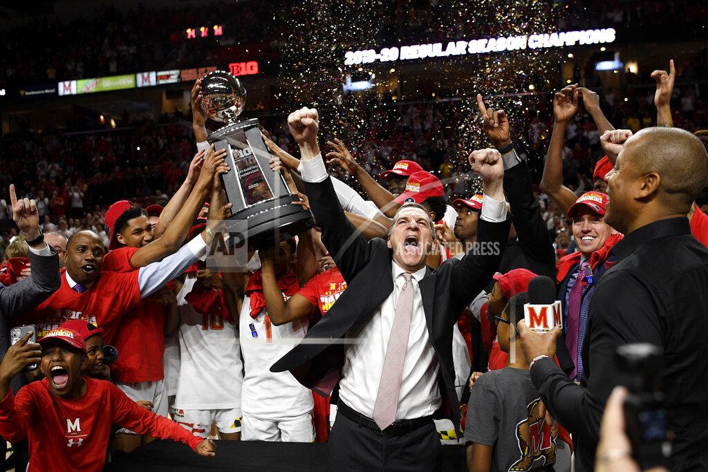 Nick Wass Maryland head coach Mark Turgeon, right center, and his team celebrate after they won a share of the Big Ten regular season title after defeating Michigan in an NCAA college basketball game, Sunday, March 8, 2020, in College Park, Md. (AP Photo/Nick Wass)