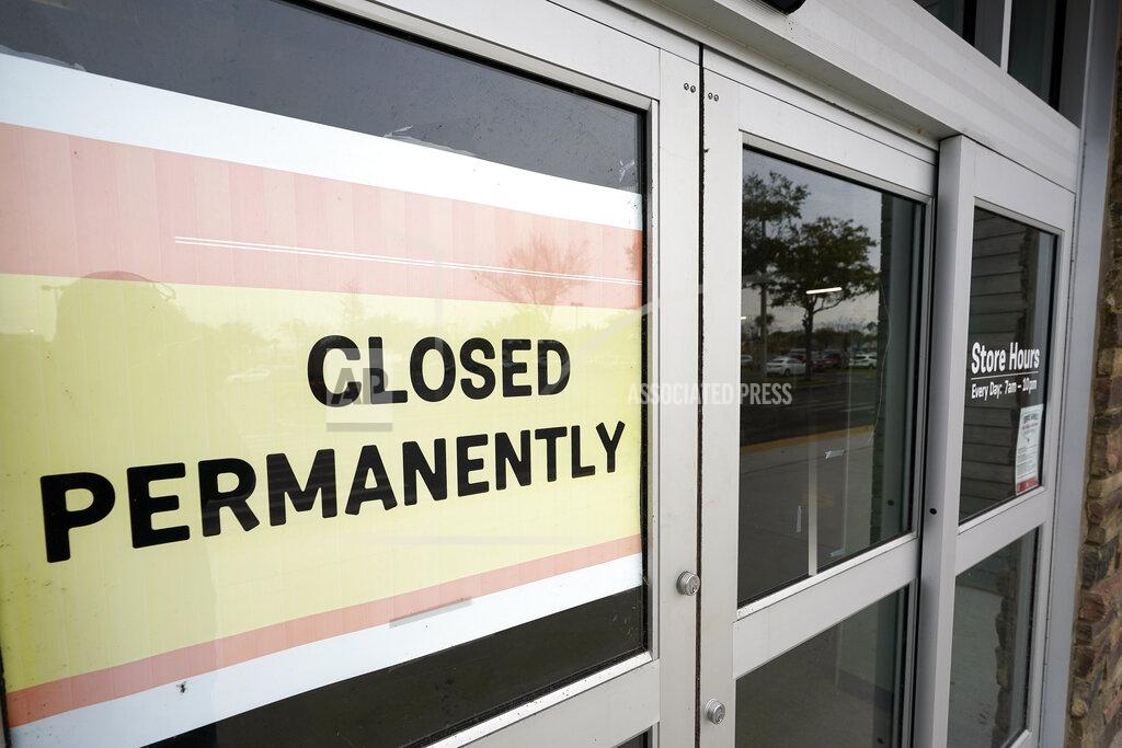 John Raoux A business that has closed permanently displays a sign near the entrance, Tuesday, Jan. 12, 2021, in Orlando, Fla. The “For Rent” signs on storefronts and offices around the world provide a stark illustration of COVID's toll on small businesses. With government restrictions and fear keeping consumers out of restaurants, stores and other establishments, businesses that operate on narrow revenue streams have struggled the past year. Or, they’ve disappeared, leaving millions of workers unemployed. (AP Photo/John Raoux)