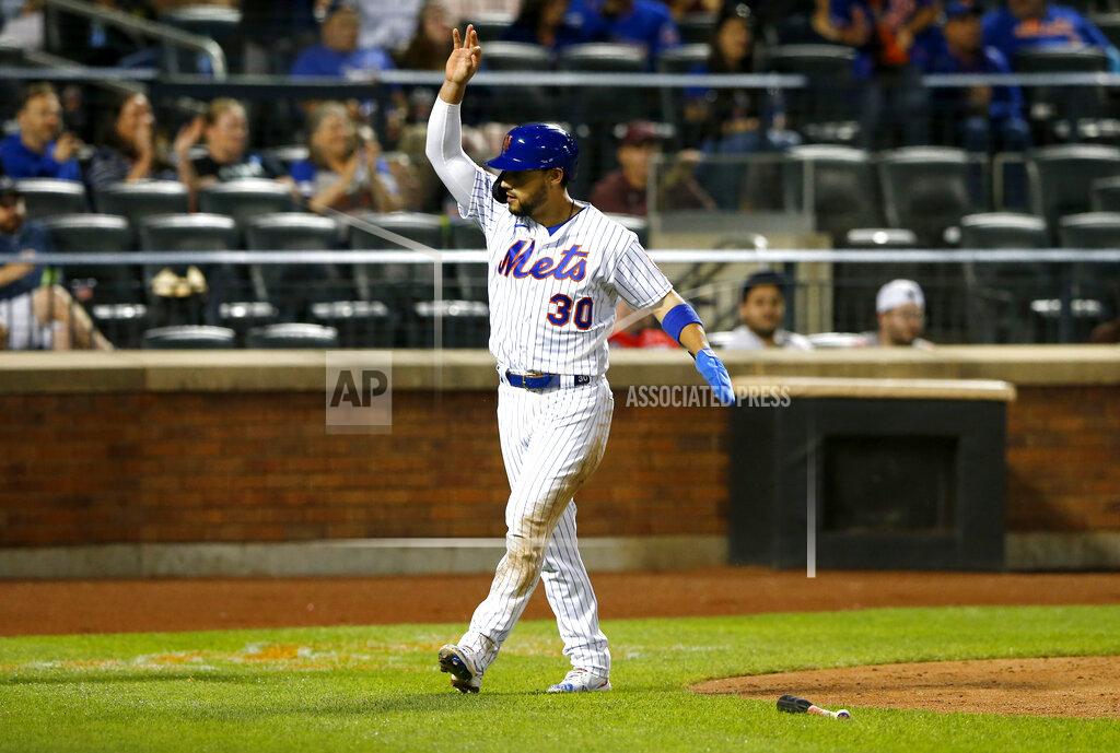 Noah K. Murray New York Mets Michael Conforto reacts after scoring against the Atlanta Braves in the seventh inning of a baseball game. Wednesday, June 23, 2021, in New York. (AP Photo/Noah K. Murray)