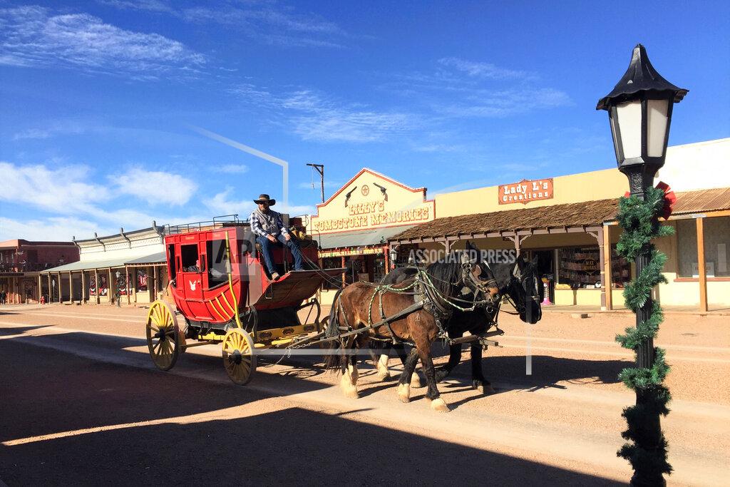 A carriage moves down a street during Associated Press journalist Brian Hannon's visit to Tombstone, Ariz., on Dec. 17, 2020. (AP Photo/Brian P. D. Hannon)