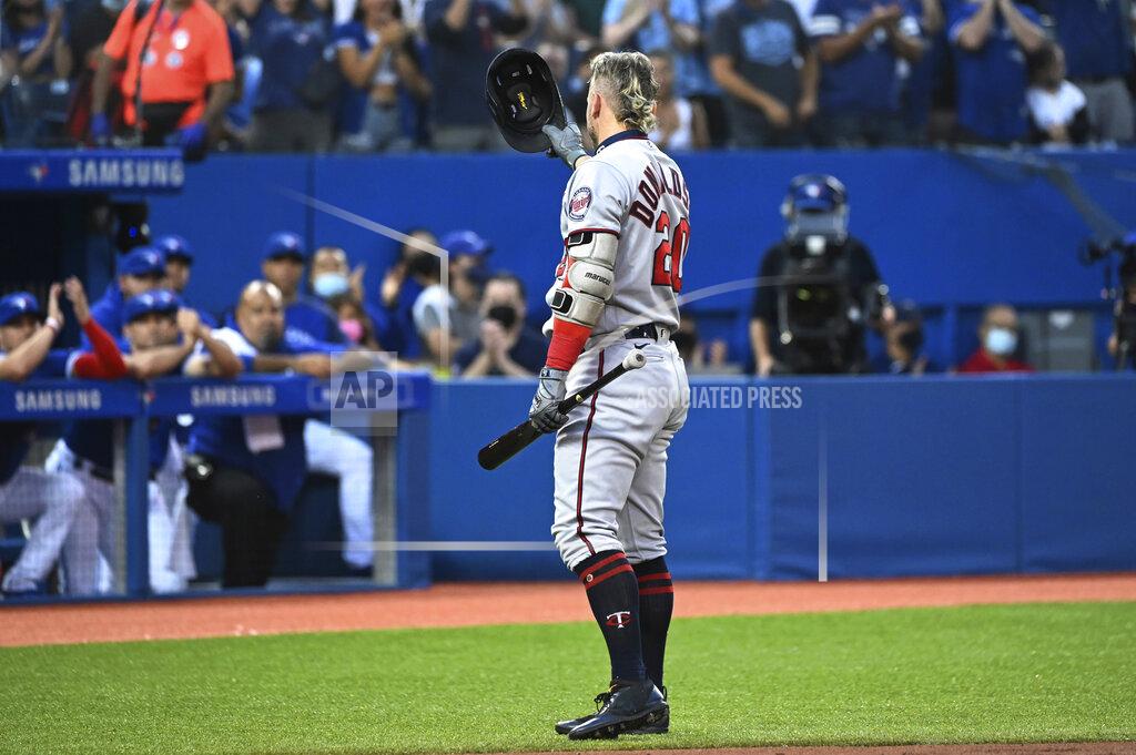 Jon Blacker Minnesota Twins' Josh Donaldson acknowledges the fans and the Toronto Blue Jays' dugout before his at-bat in the first inning of a baseball game Friday, Sept. 17, 2021, in Toronto. (Jon Blacker/The Canadian Press via AP)