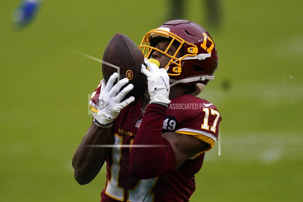 Patrick Semansky Washington Football Team wide receiver Terry McLaurin (17) catches a pass from quarterback Kyle Allen (8) for a touchdown against Dallas Cowboys in the first half of an NFL football game, Sunday, Oct. 25, 2020, in Landover, Md. (AP Photo/Patrick Semansky)