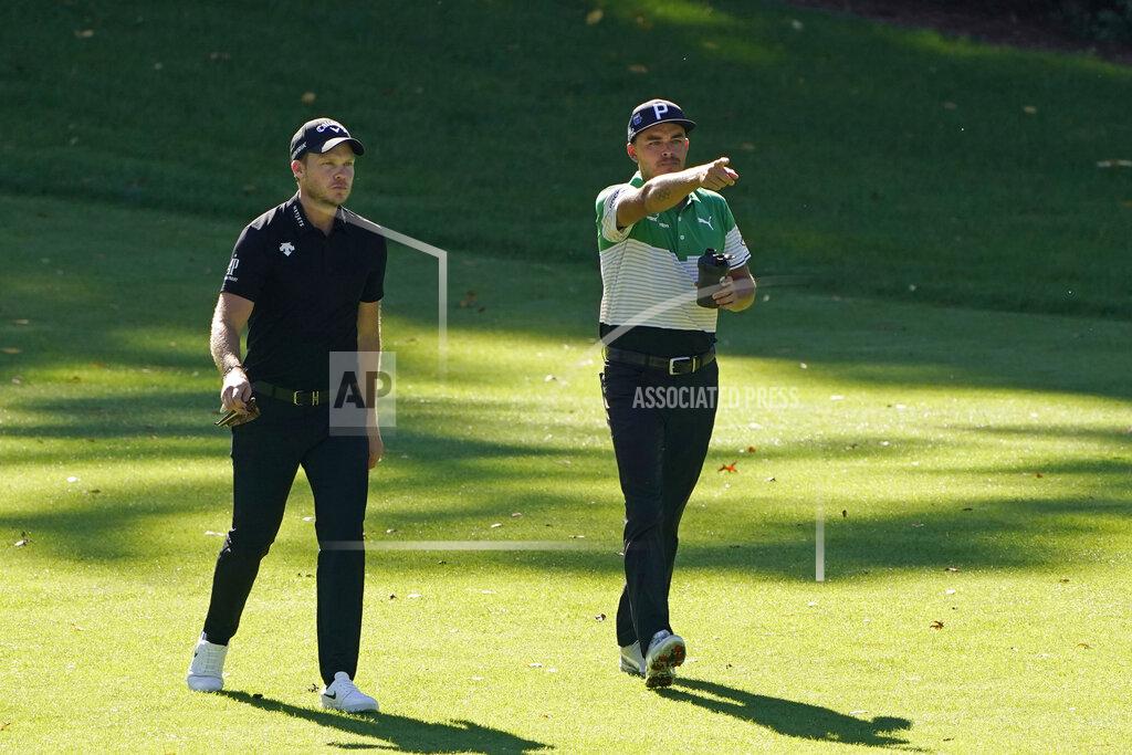 Chris Carlson Rickie Fowler, right, and Danny Willets, of England, walk down the fourth fairway during the second round of the Masters golf tournament Friday, Nov. 13, 2020, in Augusta, Ga. (AP Photo/Chris Carlson)