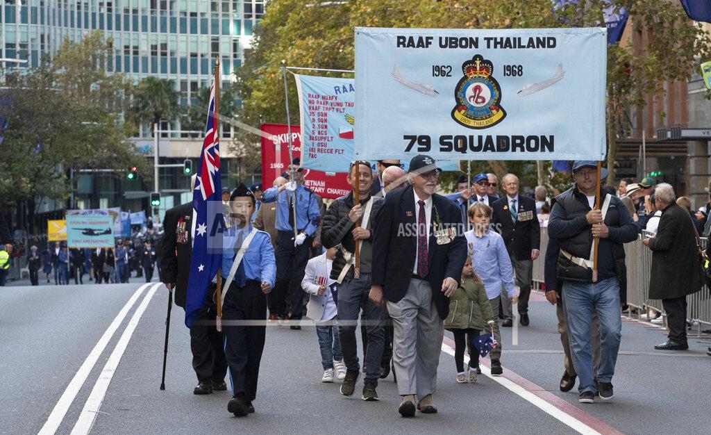 Mark Baker Veterans march during the Anzac Day parade in Sydney, Australia, Sunday, April 25, 2021. Australians and New Zealanders paid tribute to their war dead Sunday as both nations prepared to withdraw from their longest war in Afghanistan. (AP Photo/Mark Baker)