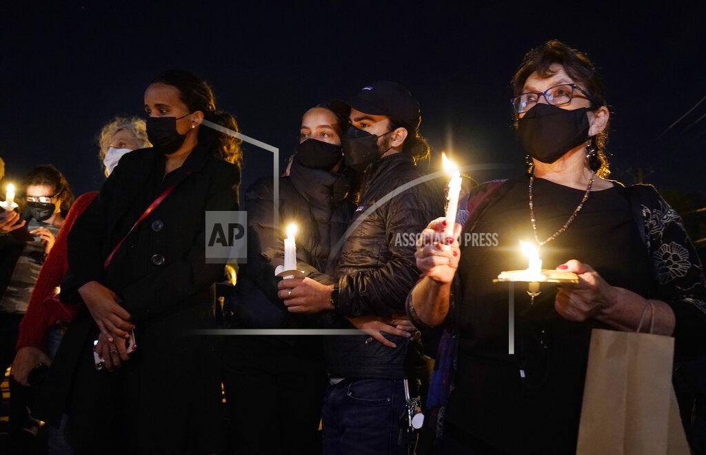 Chris Pizzello Attendees hold candles during a vigil for the late cinematographer Halyna Hutchins, Sunday, Oct. 24, 2021, in Burbank, Calif. A prop firearm discharged last Thursday by actor Alec Baldwin, while producing and starring in a Western movie in Santa Fe, N.M., killed Hutchins and wounded director Joel Souza . (AP Photo/Chris Pizzello)