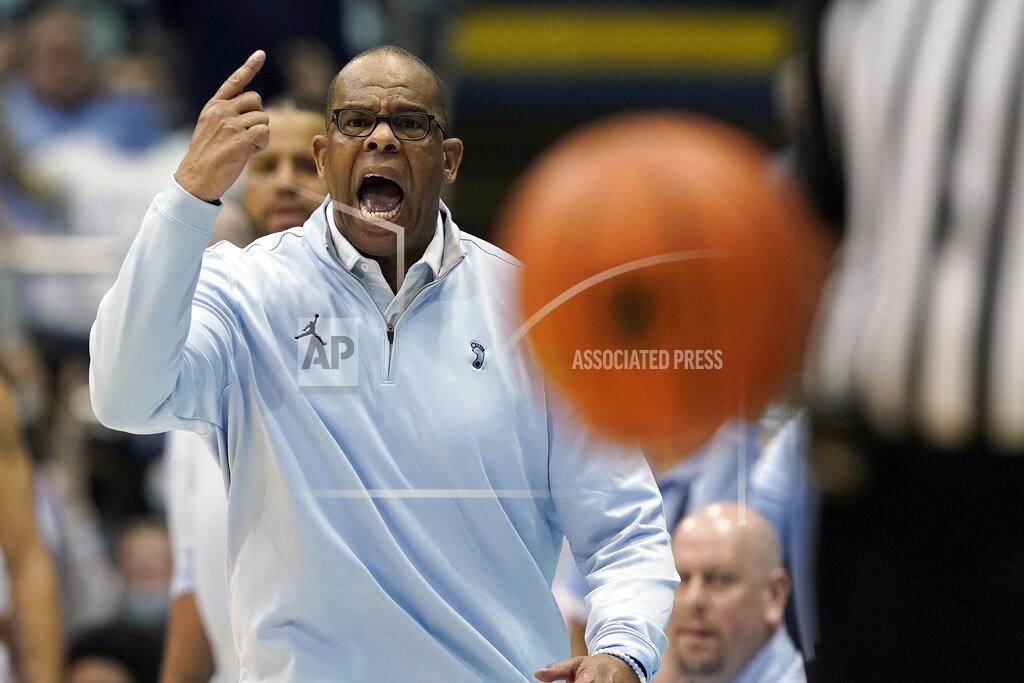 Gerry Broome North Carolina head coach Hubert Davis reacts during the second half of an NCAA college basketball game against Michigan in Chapel Hill, N.C., Wednesday, Dec. 1, 2021. (AP Photo/Gerry Broome)