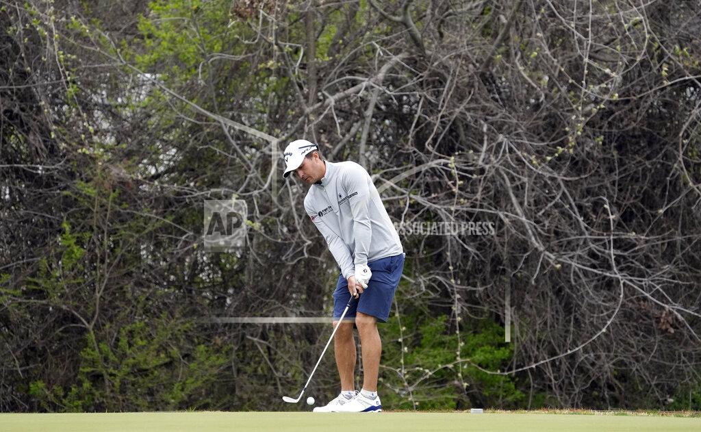 David J. Phillip Defending champion Kevin Kisner hits a chip shot on the 12th green during a practice round for the Dell Technologies Match Play Championship golf tournament Monday, March 22, 2021, in Austin, Texas. (AP Photo/David J. Phillip)