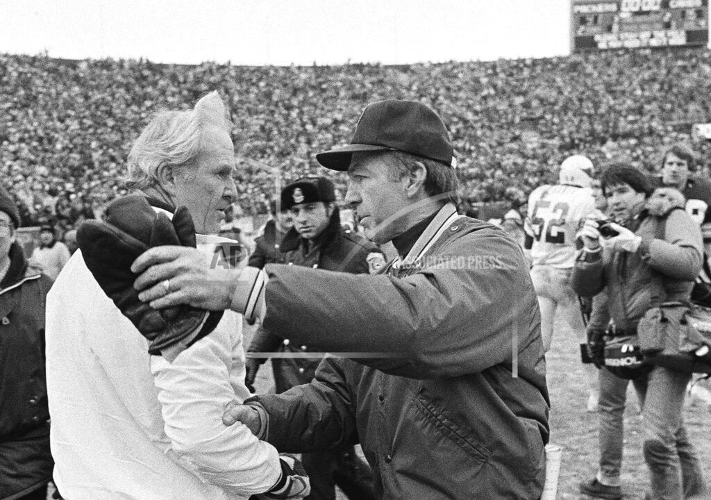 Tom Lynn FILE - In this Jan. 8, 1983, file photo, St. Louis Cardinals coach Jim Hanifan, left, and Green Bay Packers coach Bart Starr meet after the Packers' 41-16 victory in an NFL football playoff game in Green Bay, Wis. Hanifan, the former Cardinals coach who returned to the city as offensive line coach to help the Rams win the Super Bowl, has died. He was 87. Hanifan’s daughter, Kathy Hinder, told the St. Louis Post-Dispatch that he died Tuesday, Nov. 23, 2020. She said the cause of death hasn't been determined, but said it wasn't related to COVID-19. (AP Photo/Tom Lynn, File)