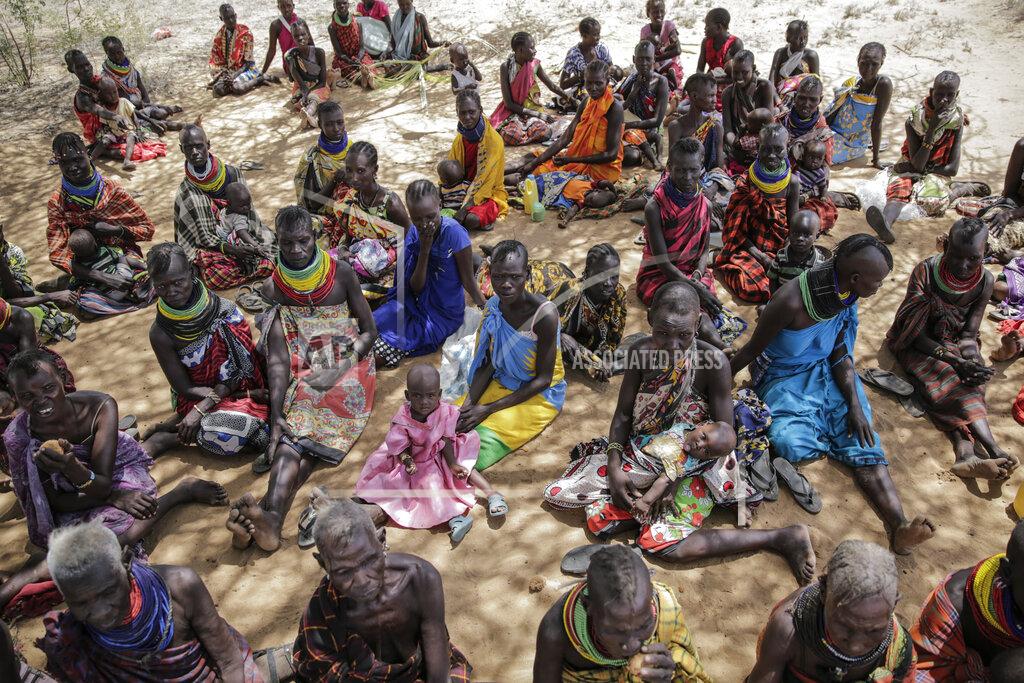 Brian Inganga Villagers gather during a visit by United Nations Under-Secretary-General for Humanitarian Affairs Martin Griffiths, in the village of Lomoputh in northern Kenya Thursday, May 12, 2022. Griffiths visited the area on Thursday to see the effects of the drought which the U.N. says is a severe climate-induced humanitarian emergency in the Horn of Africa. (AP Photo/Brian Inganga)