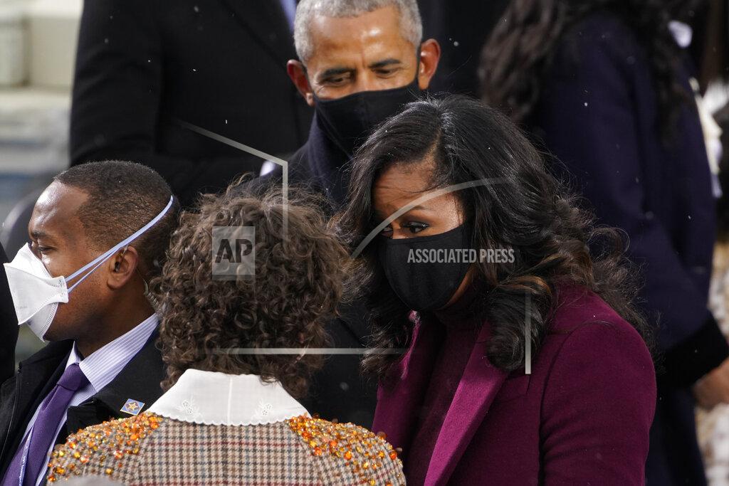 Andrew Harnik Former President Barack Obama and his wife Michelle talk with Ella Emhoff as they arrive for the 59th Presidential Inauguration at the U.S. Capitol for President-elect Joe Biden in Washington, Wednesday, Jan. 20, 2021. (AP Photo/Andrew Harnik)