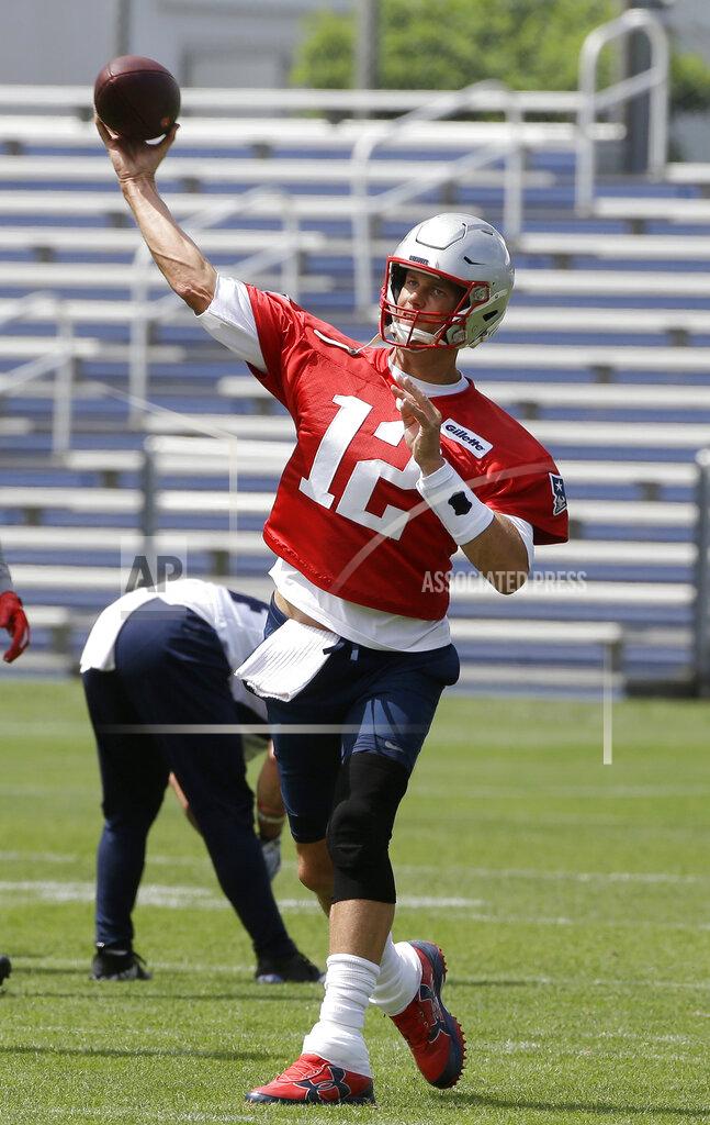 Steven Senne New England Patriots quarterback Tom Brady (12) delivers a pass during an NFL football training camp, Thursday, June 6, 2019, in Foxborough, Mass. (AP Photo/Steven Senne)