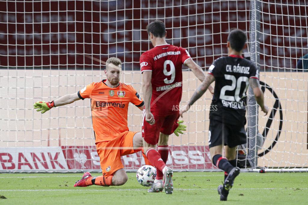 Michael Sohn Bayern's Robert Lewandowski scores his side's fourth goal during the German soccer cup (DFB Pokal) final match between Bayer 04 Leverkusen and FC Bayern Munich in Berlin, Germany, Saturday, July 4, 2020. (AP Photo/Michael Sohn)