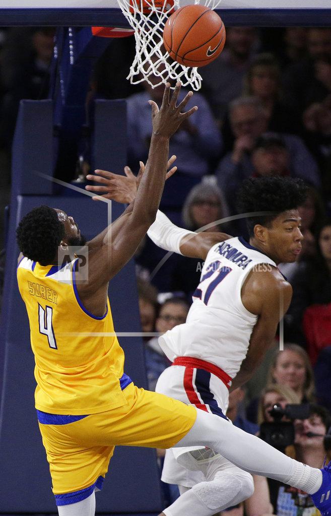 Young Kwak Cal State Bakersfield forward James Suber (4) shoots while defended by Gonzaga forward Rui Hachimura (21) during the first half of an NCAA college basketball game in Spokane, Wash., Monday, Dec. 31, 2018. (AP Photo/Young Kwak)