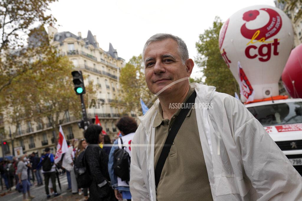 Francois Mori Medical Doctor Christian Prudhomme attends a protest gathering outside the Health Ministry, in Paris, Tuesday, Sept. 14, 2021 against a law requiring them to get vaccinated by Wednesday or risk suspension from their jobs. The law is aimed at protecting patients from new surges of COVID-19. Most of the French population is vaccinated but a vocal minority are against the vaccine mandate. (AP Photo/Francois Mori)