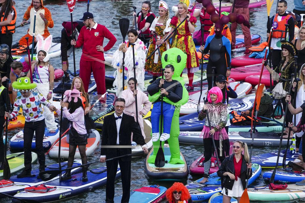 Pavel Golovkin People steer their SUP boards during a SUP (Stand Up Paddle)-Surfing festival at Krylatskoye Olympic rowing canal in Moscow, Russia, Sunday, Sept. 12, 2021. (AP Photo/Pavel Golovkin)