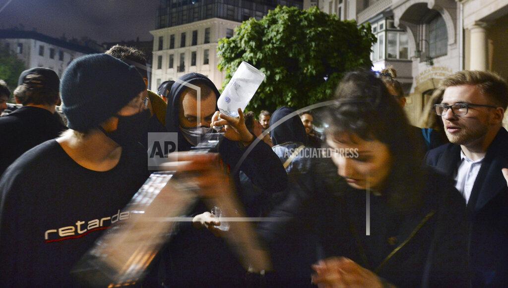 Czarek Sokolowski People gather and celebrate as bars, clubs and other establishments reopened in Poland after being closed for seven months, in Warsaw, Poland, Friday, May 14, 2021. (AP Photo/Czarek Sokolowski)