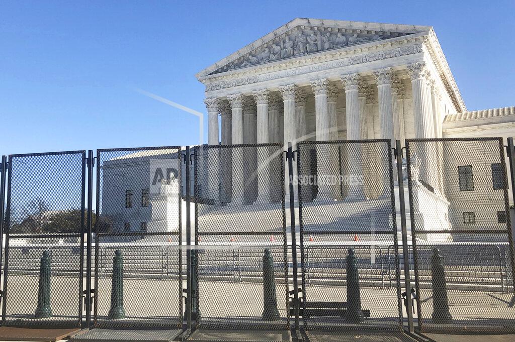 Alan Fram Anti-scaling fencing has been placed in front of the Supreme Court, which stands across the street from the U.S. Capitol, Sunday, Jan. 10, 2021, in Washington. (AP Photo/Alan Fram)