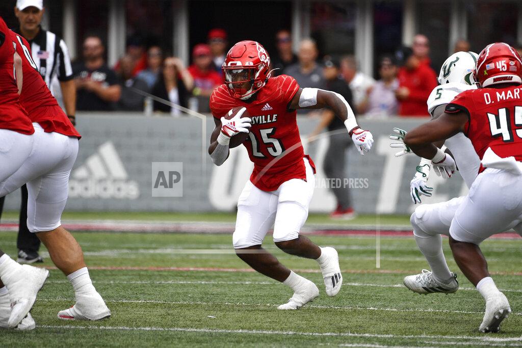 Timothy D. Easley Louisville running back Jawhar Jordan (25) runs through an opening in the South Florida defensive line during the first half of an NCAA college football game in Louisville, Ky., Saturday, Sept. 24, 2022. (AP Photo/Timothy D. Easley)