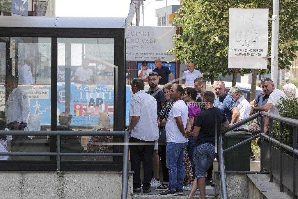 Visar Kryeziu Kosovars wait in line outside a visa application center in Kosovo's capital Pristina, Tuesday, June 28, 2022. The European Union’s delay in allowing visa-free travel for the people of Kosovo has spread dismay and resentment in the continent’s newest state, and one Pristina businessman has retaliated by hitting EU officials where it hurts — the stomach. (AP Photo/Visar Kryeziu)