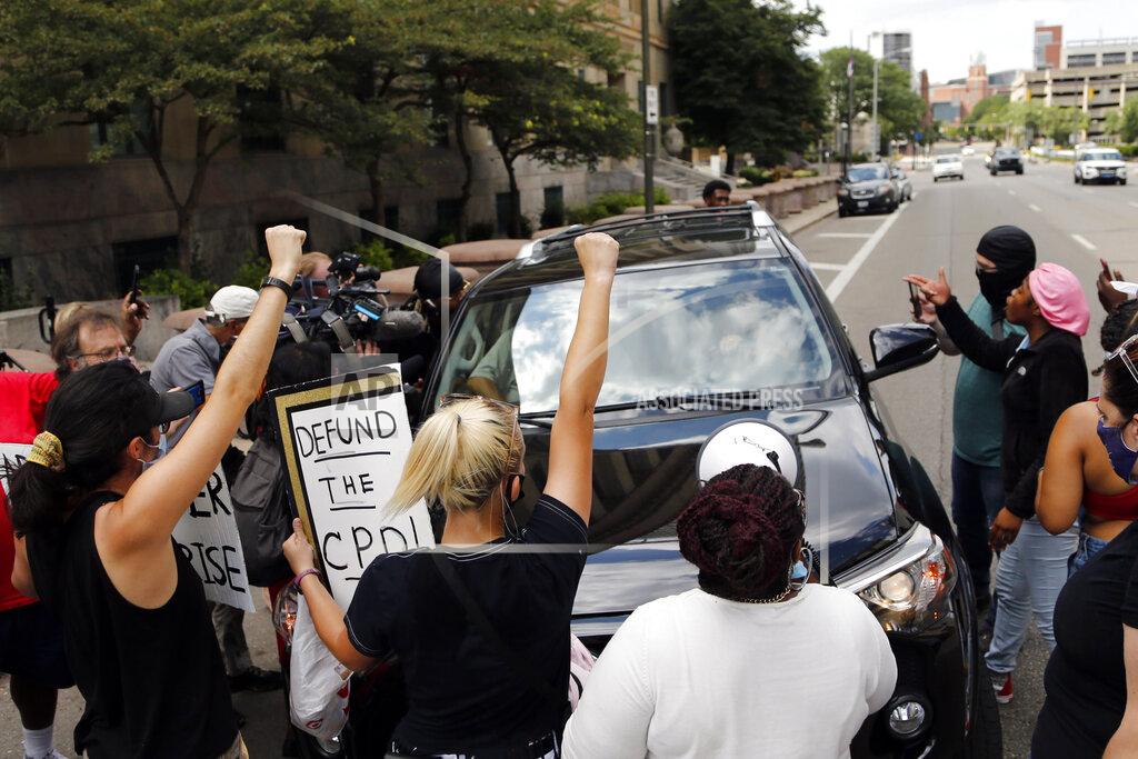 Jay Laprete FILE — In this July 21, 2020 file photo, protestors block a car, with Ohio House Speaker Larry Householder inside, from leaving the Federal Courthouse after Householder was arrested in a $60 million federal bribery probe, in Columbus, Ohio. (AP Photo/Jay LaPrete, File)
