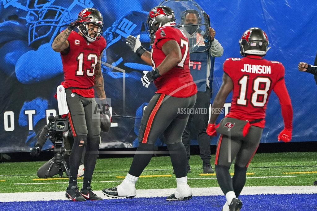 Corey Sipkin Tampa Bay Buccaneers' Mike Evans, left, celebrates his touchdown with teammates during the second half of an NFL football game against the New York Giants, Monday, Nov. 2, 2020, in East Rutherford, N.J. (AP Photo/Corey Sipkin)