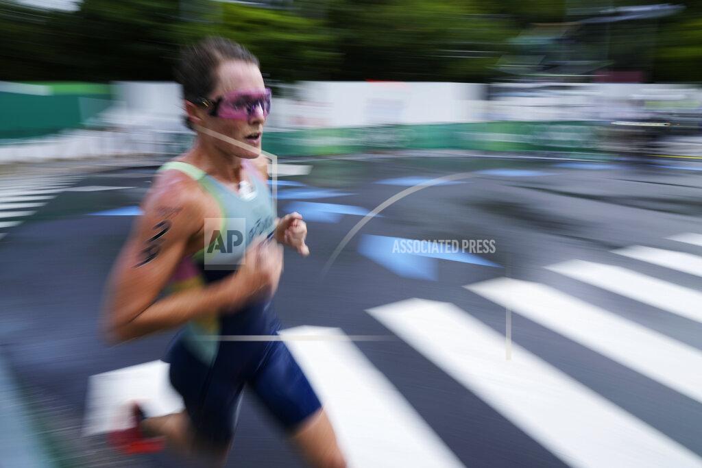 Eugene Hoshiko Flora Duffy, of Bermuda, runs during the women's triathlon competition at the 2020 Summer Olympics Tuesday, July 27, 2021, in Tokyo, Japan. (AP Photo/Eugene Hoshiko)