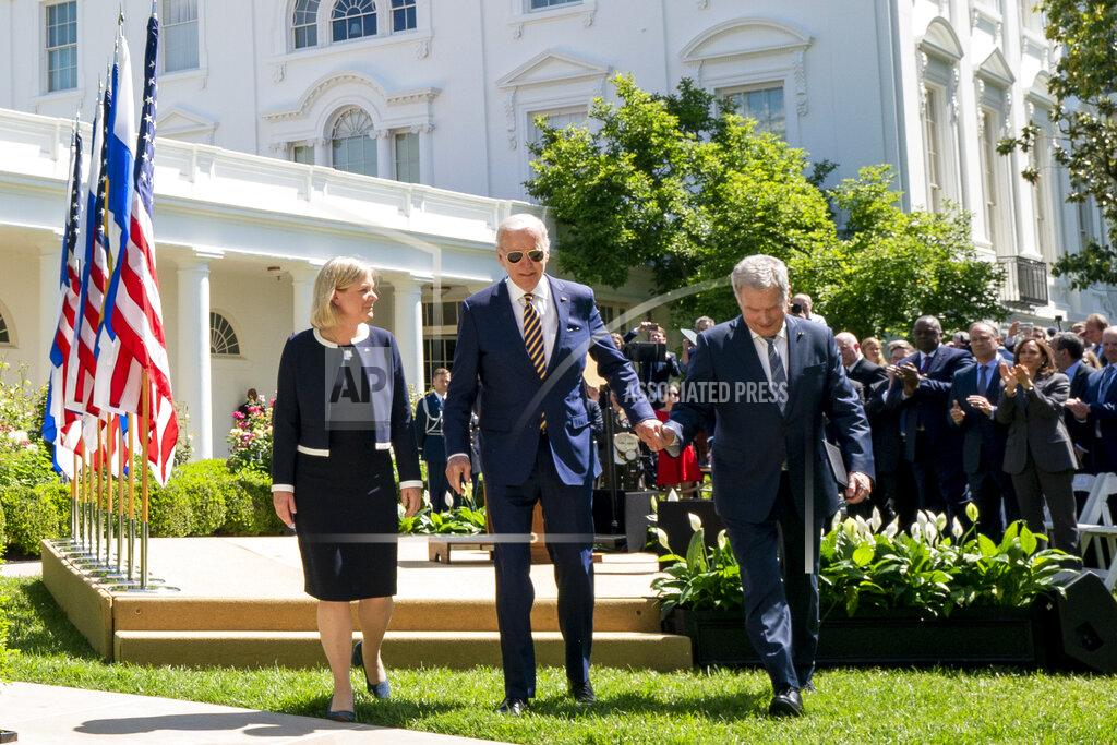Andrew Harnik President Joe Biden departs with Swedish Prime Minister Magdalena Andersson, left, and Finnish President Sauli Niinisto, right, after speaking in the Rose Garden at the White House in Washington, Thursday, May 19, 2022. (AP Photo/Andrew Harnik)