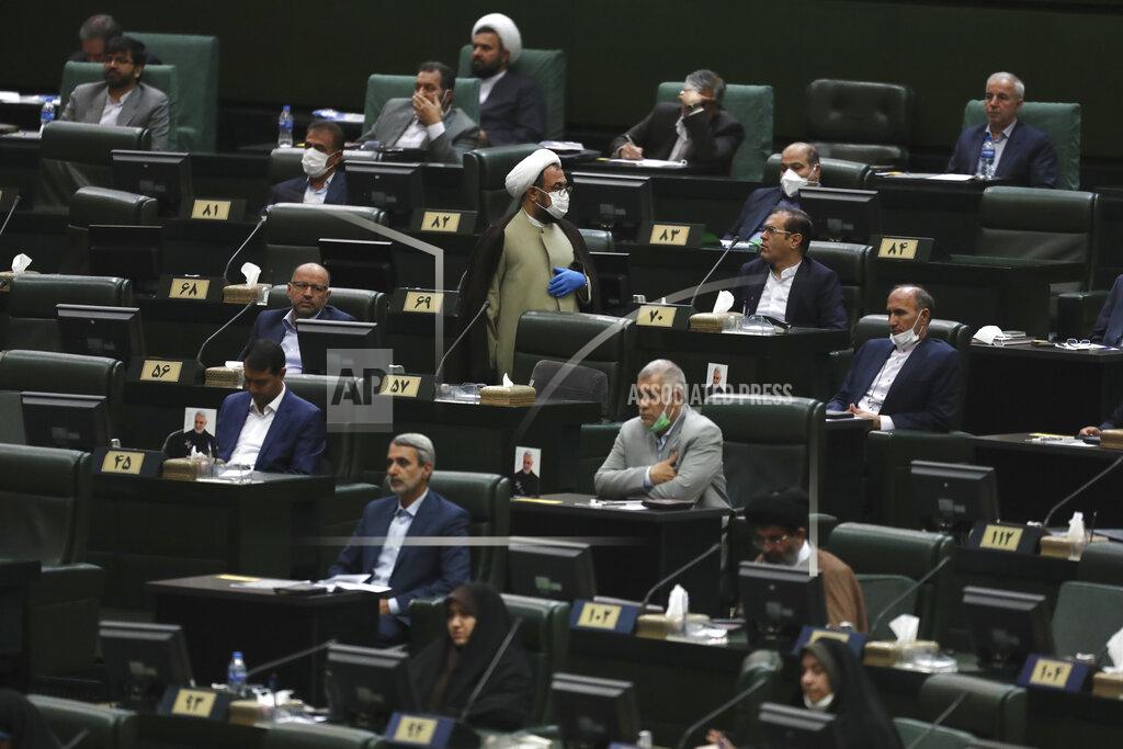 Vahid Salemi Lawmakers listen to a speech during the inauguration ceremony of Iran's new parliament, in Tehran, Iran, Wednesday, May, 27, 2020. Iran convened its newly elected parliament, dominated by conservative lawmakers and under strict social distancing regulations, as the country struggles to curb the spread of coronavirus that has hit the nation hard. Iran is grappling with one of the deadliest outbreaks in the Middle East. (AP Photo/Vahid Salemi)