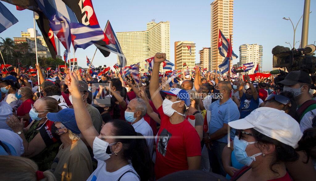 Ismael Francisco People attend a cultural-political event on the seaside Malecon Avenue with thousands of people in a show of support for the Cuban revolution six days after the uprising of anti-government protesters across the island, in Havana, Cuba, Saturday, July 17, 2021. (AP Photo / Ismael Francisco)