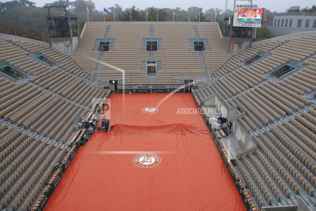 Michel Euler View of the empty seats on Suzanne Lenglen court as rain suspended most matches in the first round of the French Open tennis tournament at the Roland Garros stadium in Paris, France, Monday, Sept. 28, 2020. (AP Photo/Michel Euler)